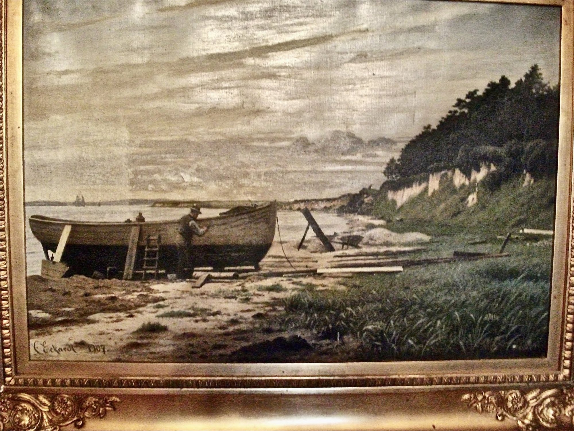 Christian Eckardts maleri af Wedellsborg Slot og en fisker ved sin jolle på stranden.